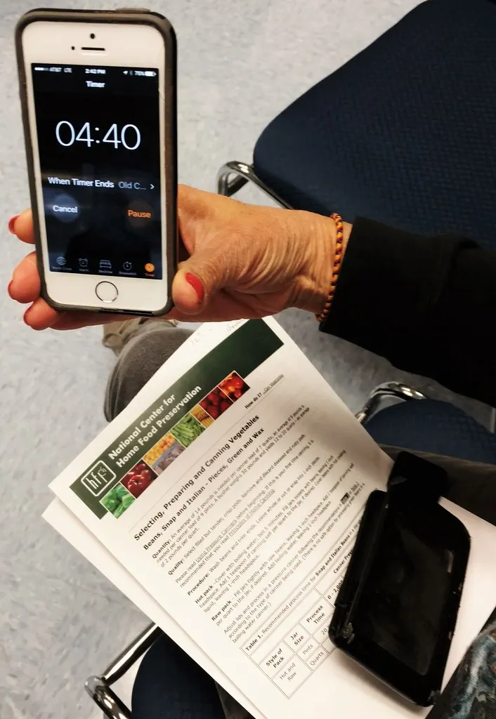 Phone showing a simple session timer beside playing cards